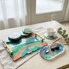 multicoloured tray and coaster set with coffee small tray