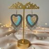 Heart-shaped oxidised jhumka with blue tones and golden flakes Heart-shaped oxidised jhumka with blue tones and golden flakes