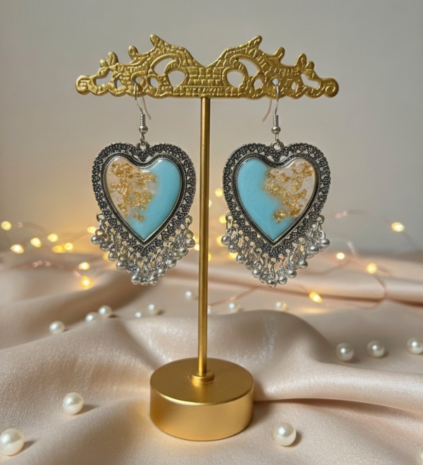 Heart-shaped oxidised jhumka with blue tones and golden flakes Heart-shaped oxidised jhumka with blue tones and golden flakes