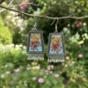 Boho-Ethnic Oxidised Resin Jhumka with Real Flower, Golden Flakes & Pastel Colour Boho-Ethnic Oxidised Resin Jhumka with Real Flower, Golden Flakes & Pastel Colour