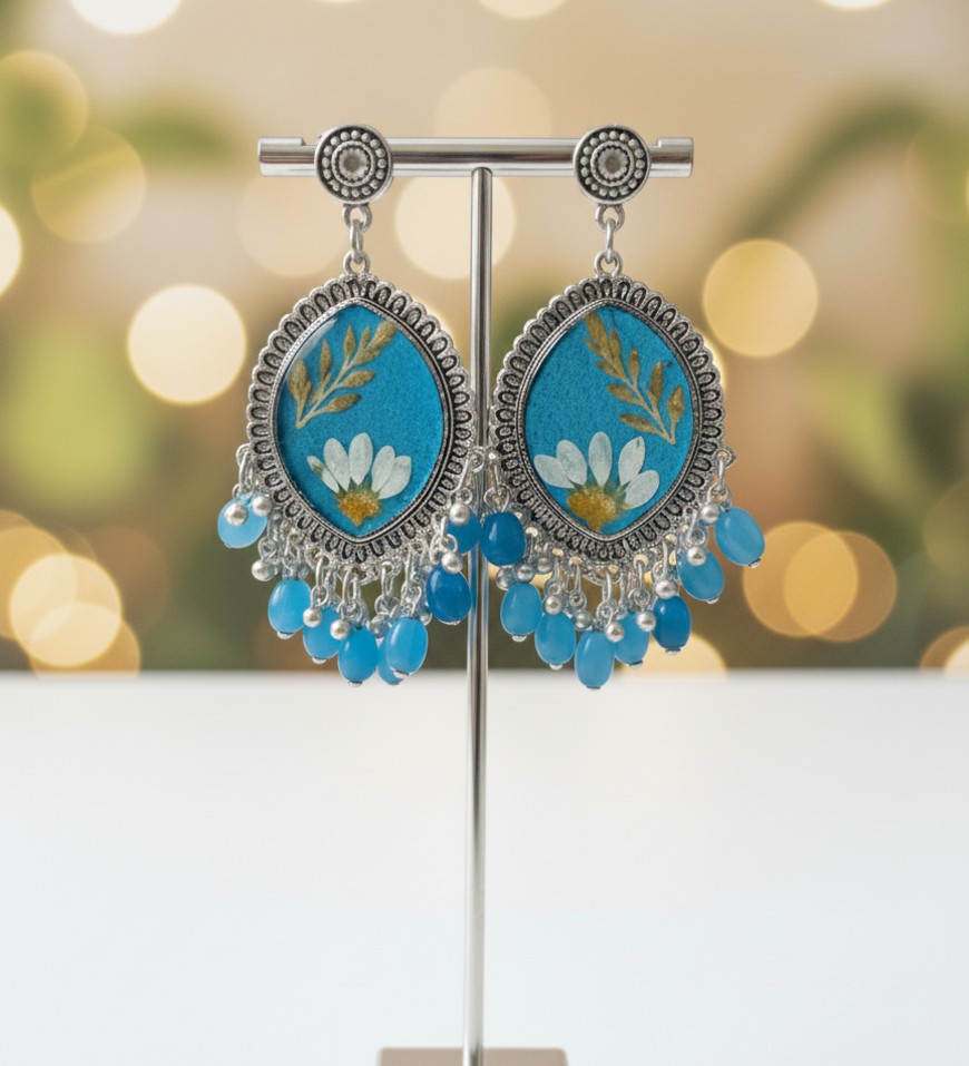 Royal blue floral resin pearl jhumka Royal blue floral resin pearl jhumka